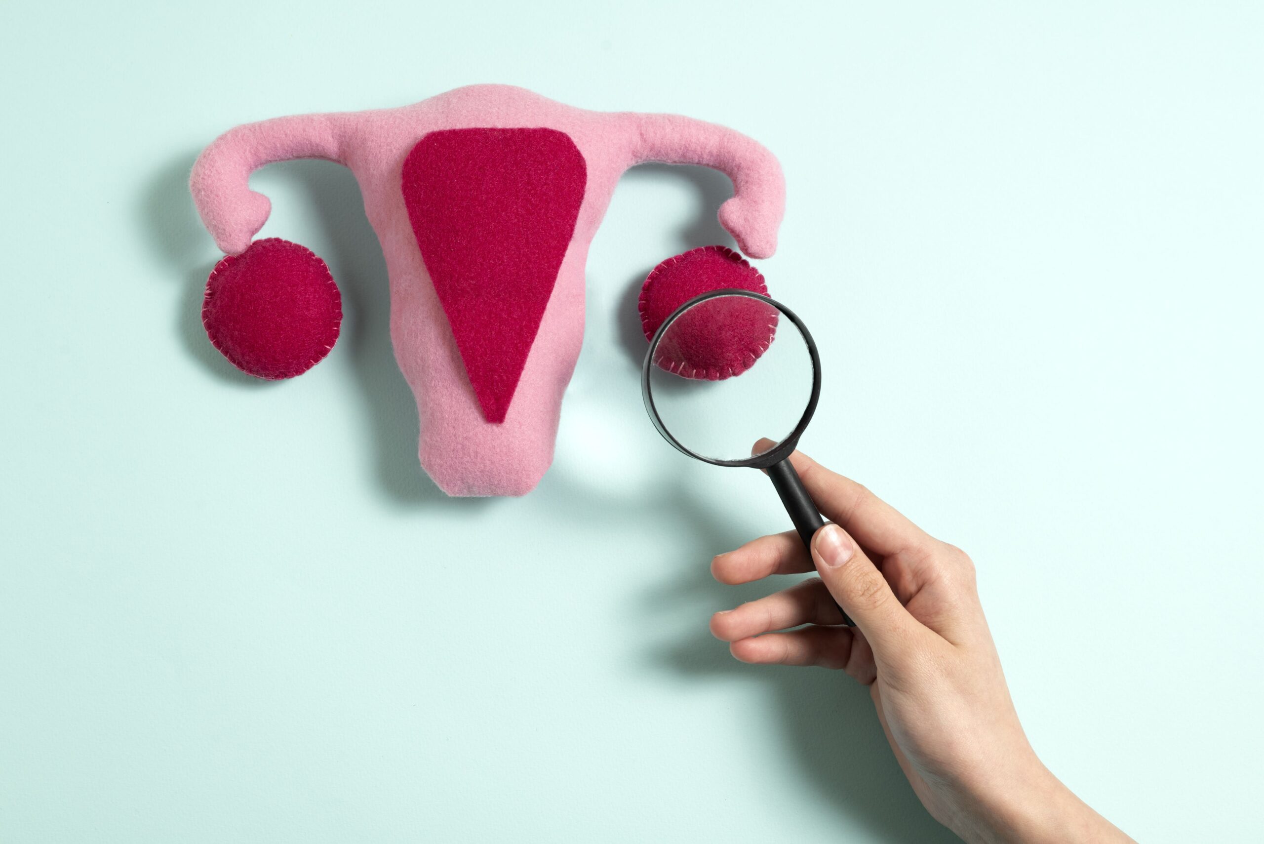 flat-lay-hand-holding-magnifying-glass (1)